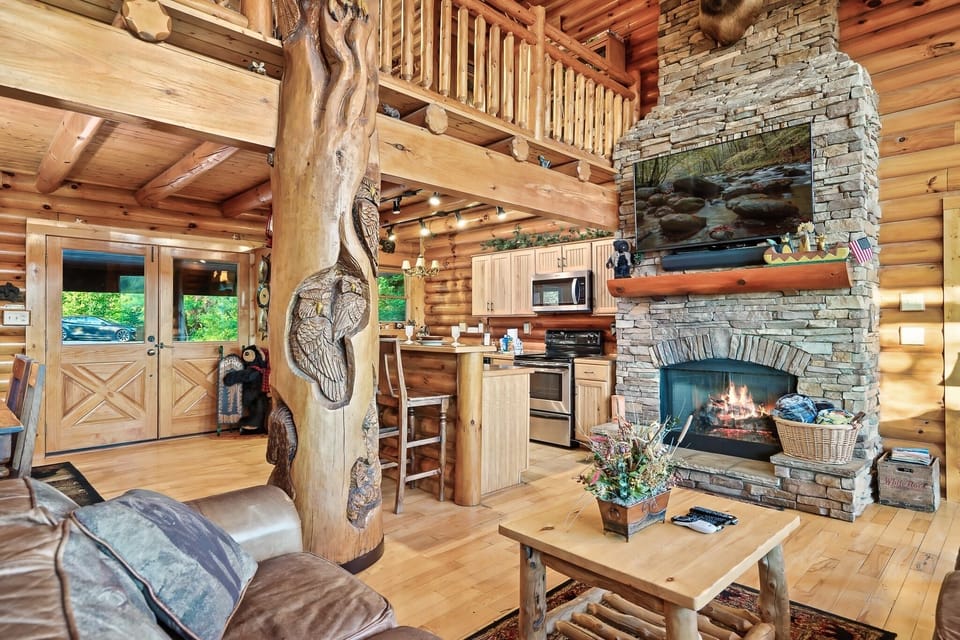 Great Room featuring hand carved wooden posts and gas fireplace
