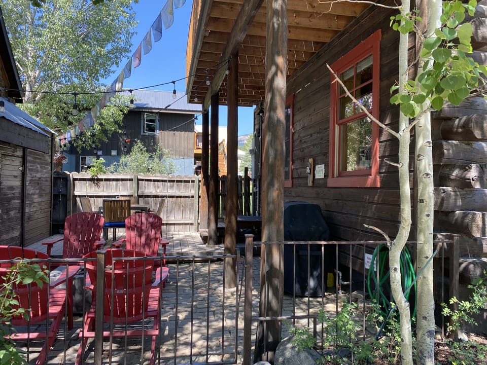 Great side patio for relaxing, dining and grilling
