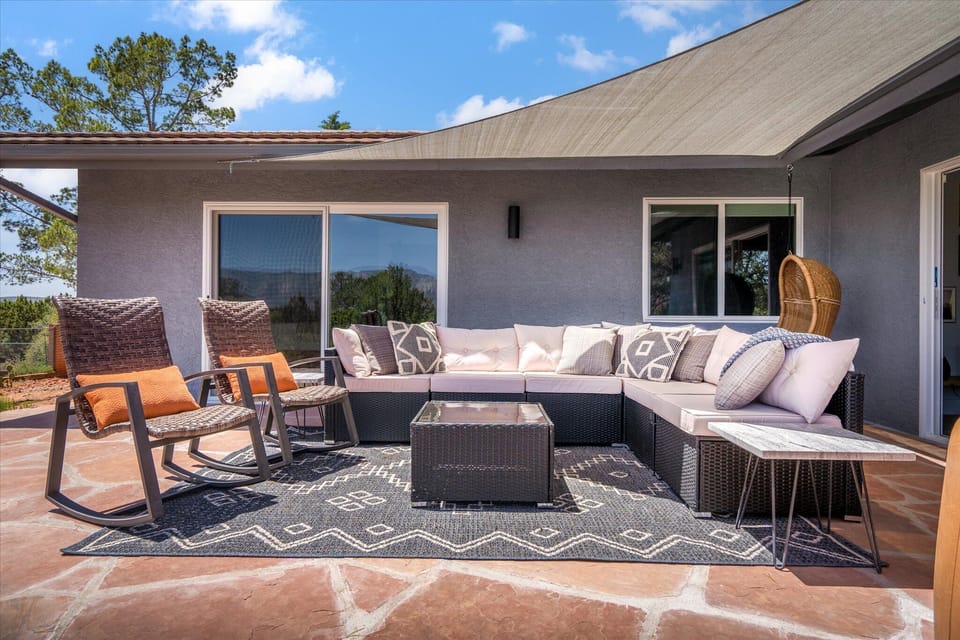 Our gorgeous back patio complete with a hanging chair to enjoy the views