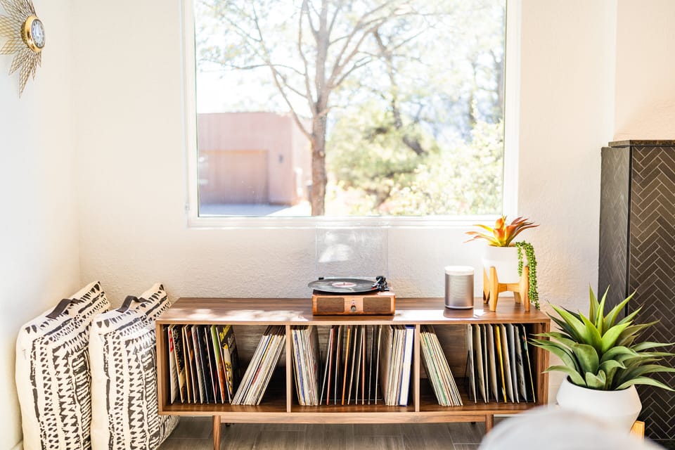 record player with tons of vintage records to enjoy, along with a Sonos speaker