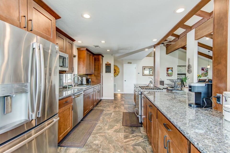 Spacious Kitchen with Plenty of Stone Counter Space