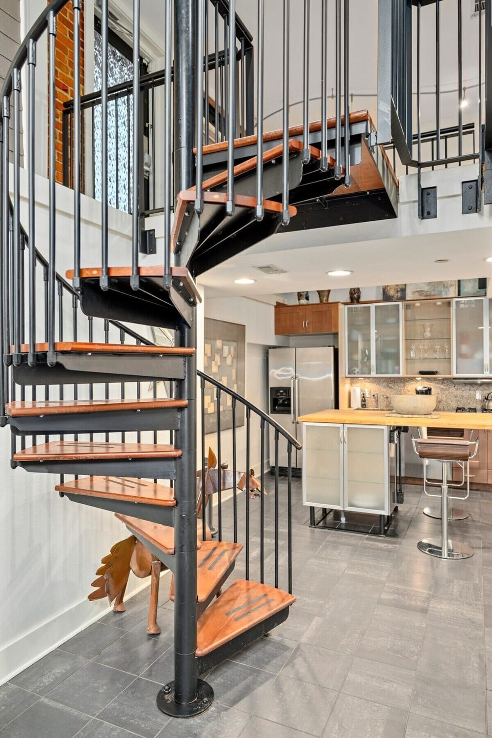 This spiral staircase adds to the downtown loft feel of our home!