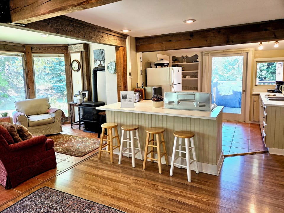 Full kitchen with extra sitting room off to the side. 
