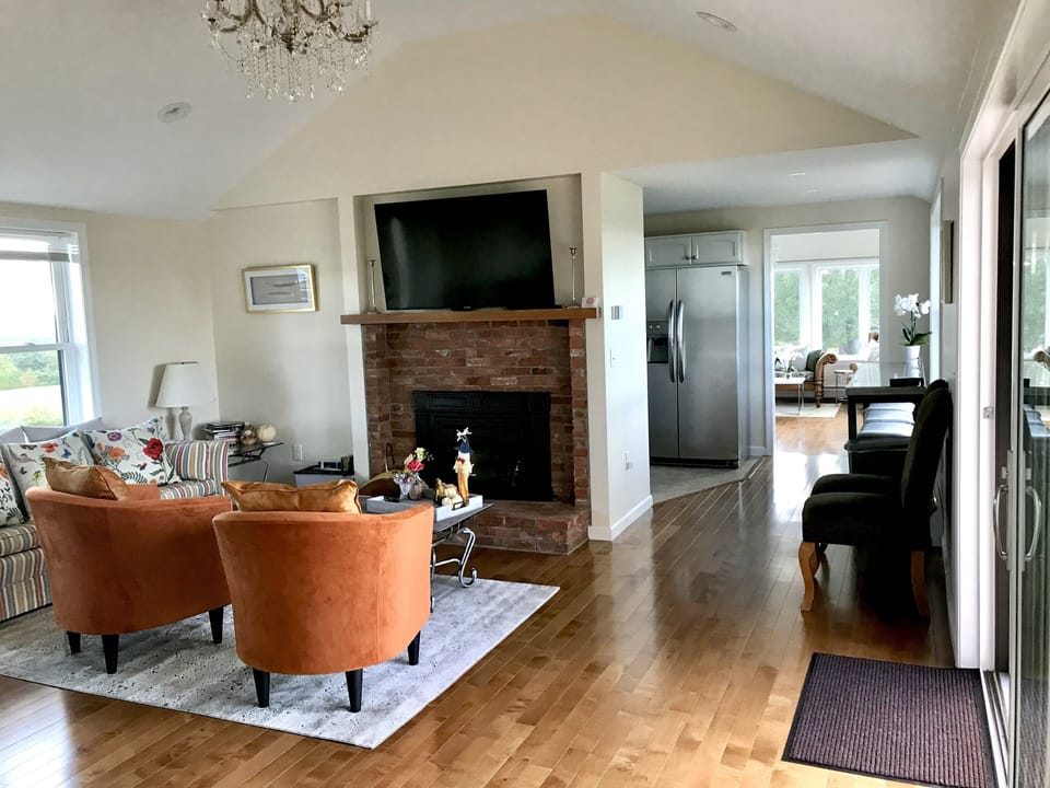 Family room with smart TV and fireplace.