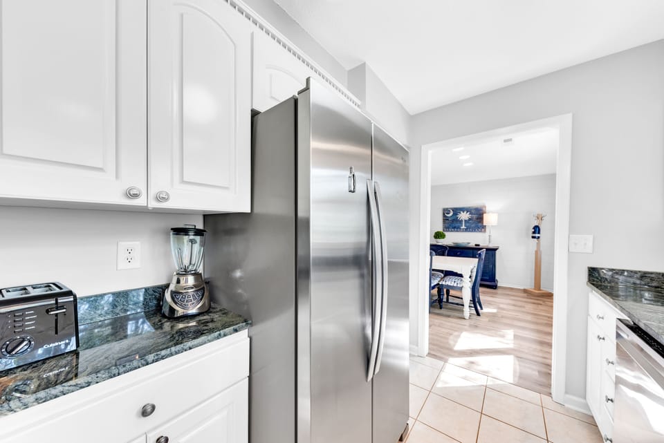 Large French door refrigerator and tile floors