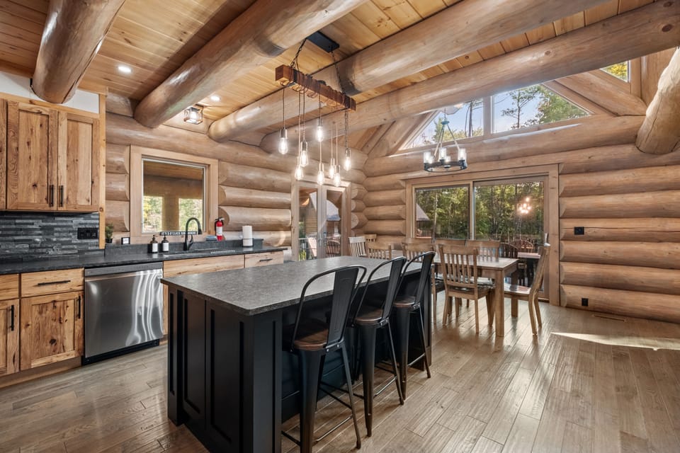 The kitchen's open layout connects seamlessly to the dining and living areas