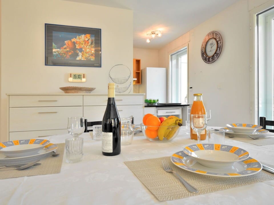 Table, Property, Tableware, Furniture, Picture Frame, Orange, Wood, Bottle, Tablecloth, Interior Design
