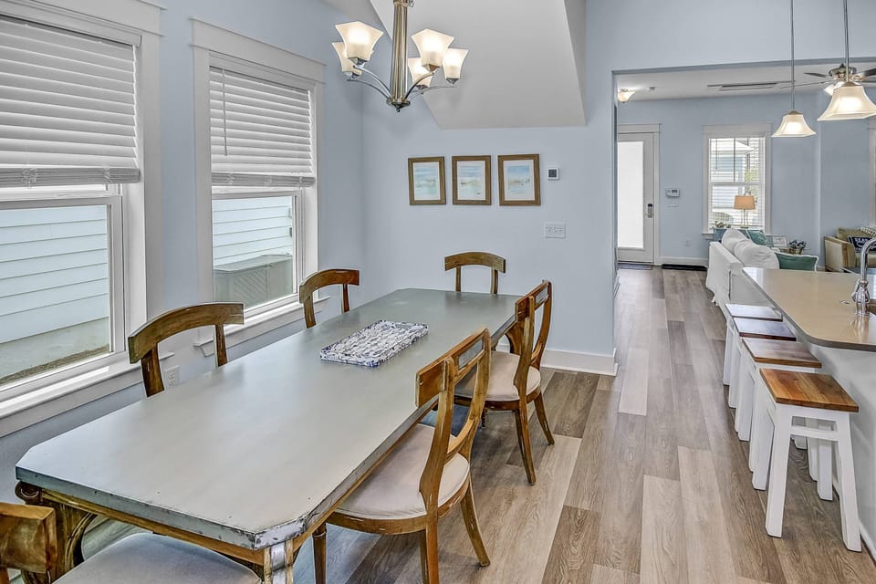 Open concept kitchen and dining area with seating for 6 & additional seating at the kitchen island