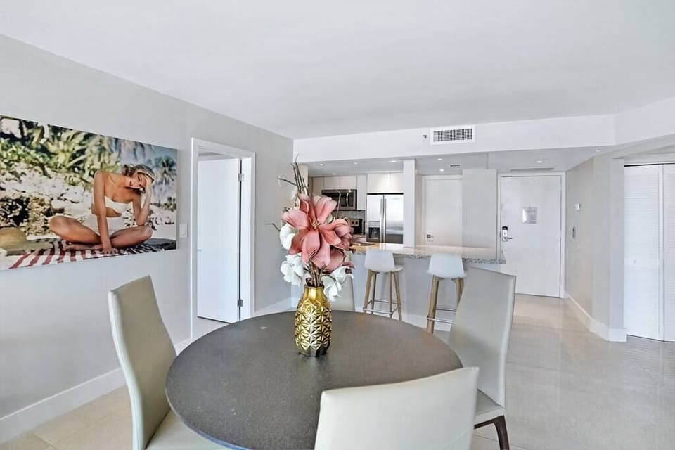 Dining area, seating at kitchen counter, fully equipped kitchen, front entrance