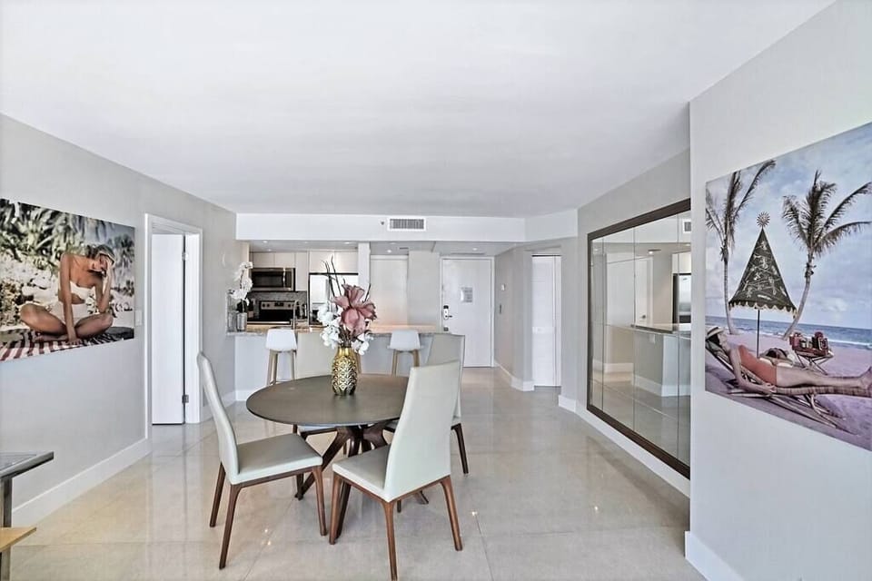 Living area, fully equipped kitchen, dining area, balcony access