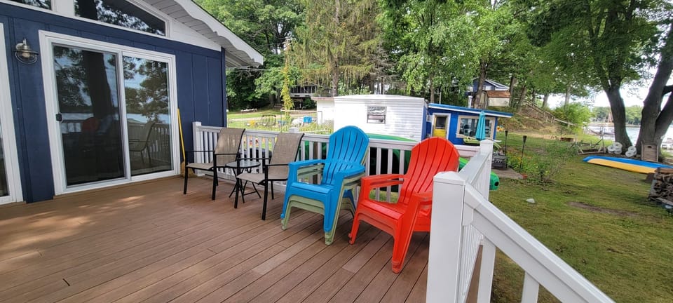 Variety of outdoor furniture provided, including a hammock with lake view! 