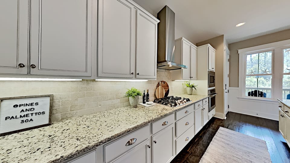 The Gourmet Designed Kitchen has plenty of counter space and is conveniently located next to the Garage entry.