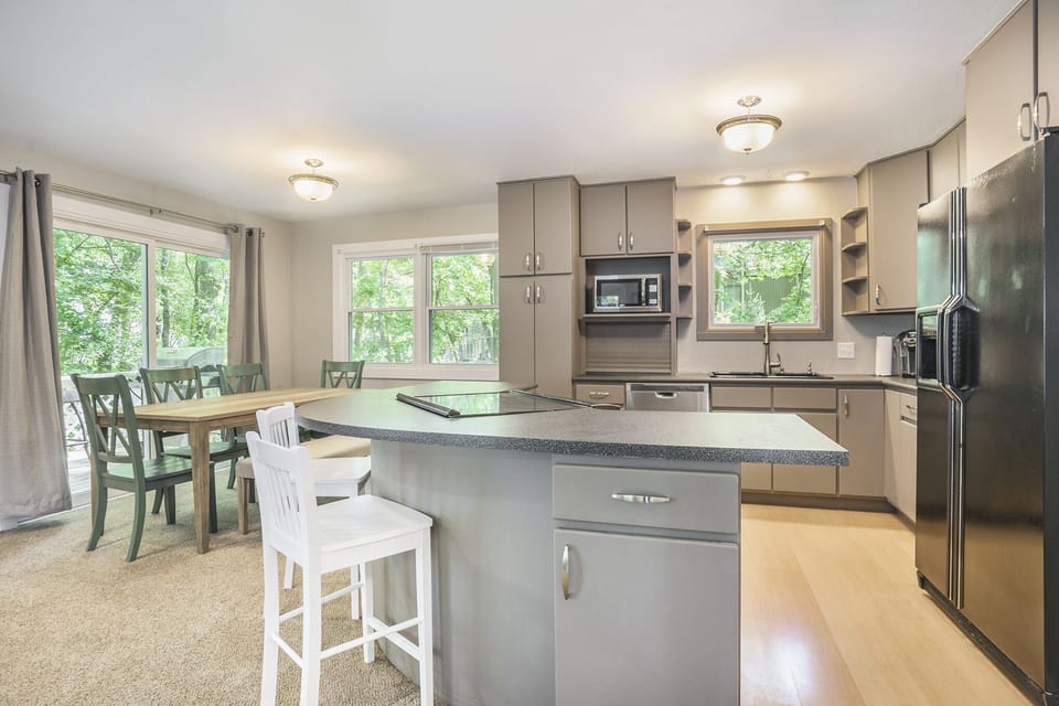 Open concept kitchen/dining/living space