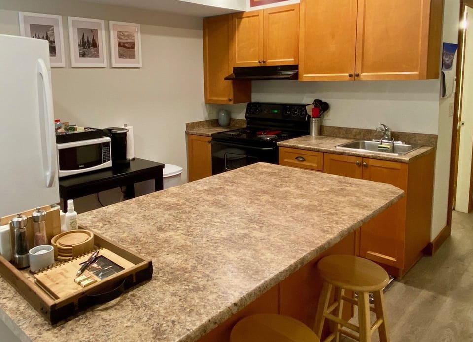 Fully stocked kitchen. Full size fridge, oven, basic cooking staples provided
