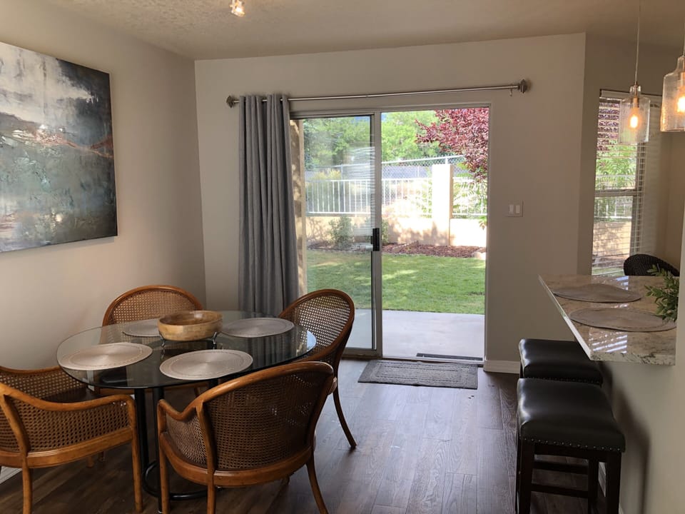 Dining area seats 4 at the table and 2 at the breakfast bar.  What a view!