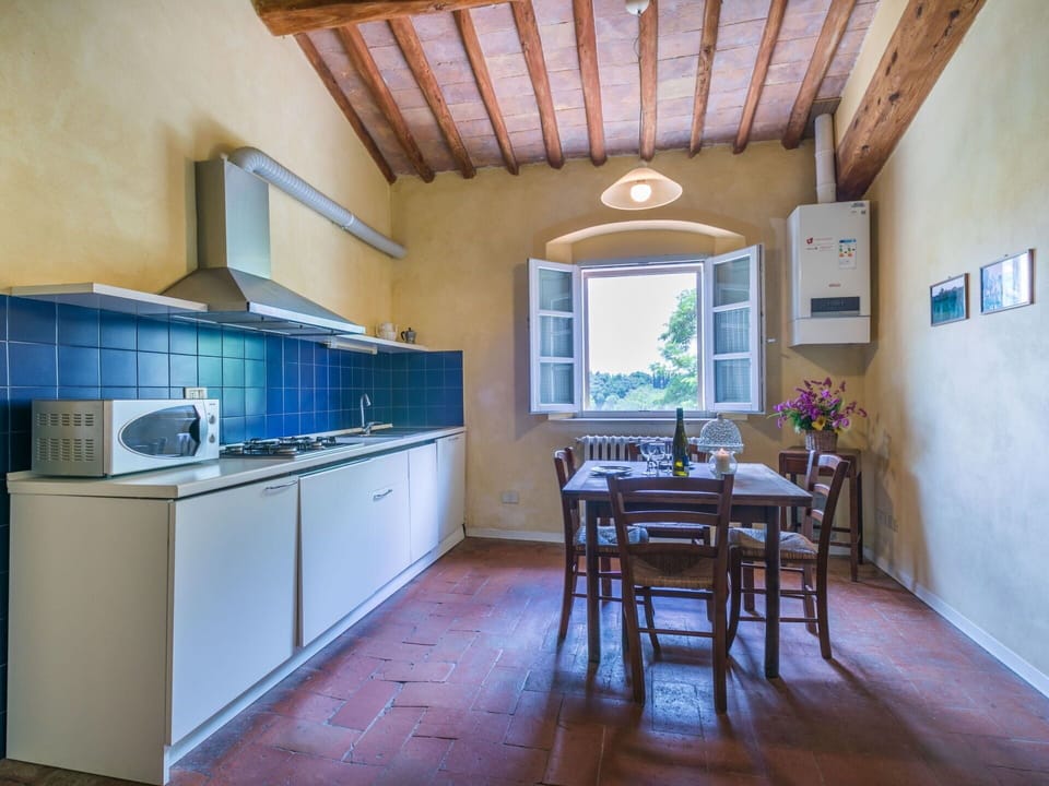 Cabinetry, Property, Furniture, Countertop, Wood, Window, Table, Tap, Kitchen Appliance, Kitchen Stove