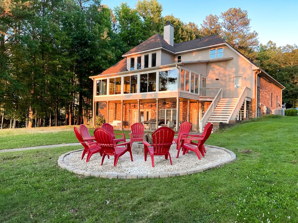 View of the home and fire pit