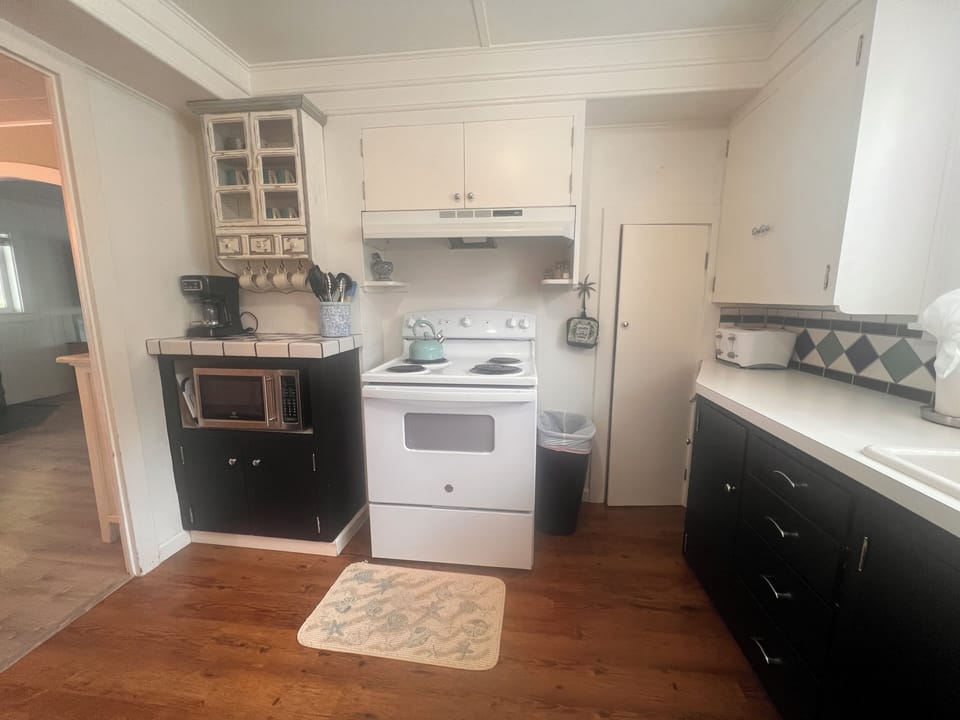 Your fully equipped kitchen awaits with modern appliances and ample storage for preparing delicious meals during your stay.