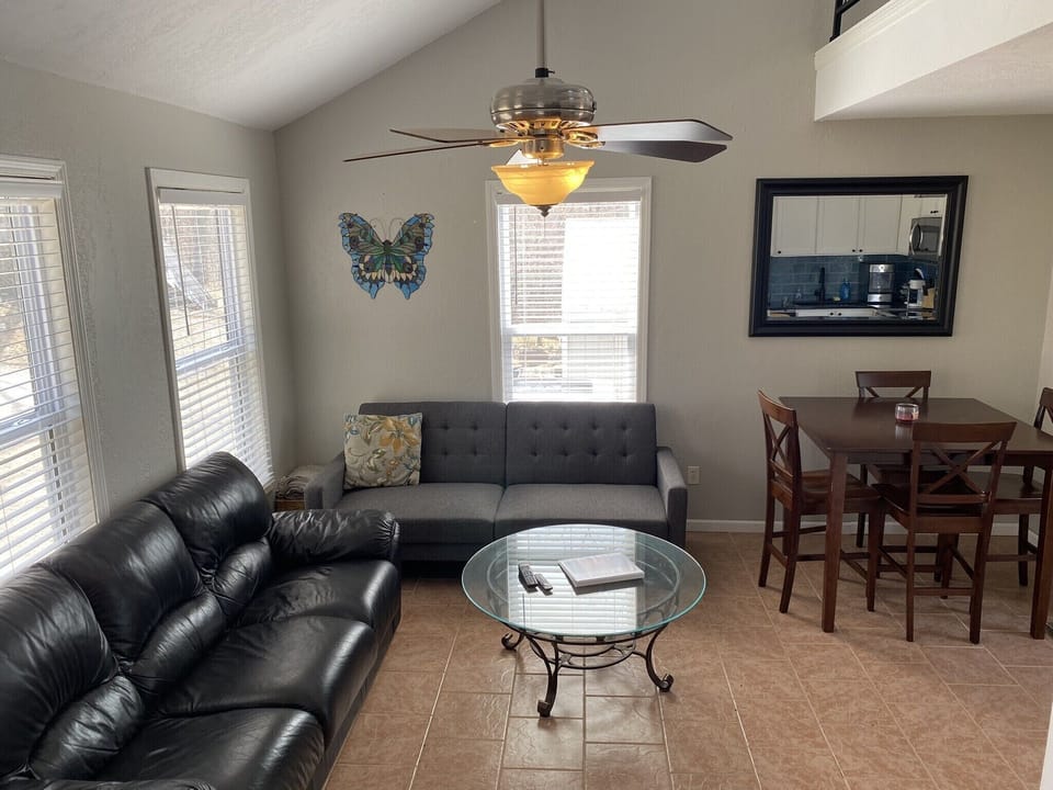 Living room with couch, futon, and table 