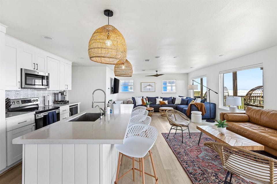 Effortless flow from kitchen to living — gather your group, the waves are always in view.