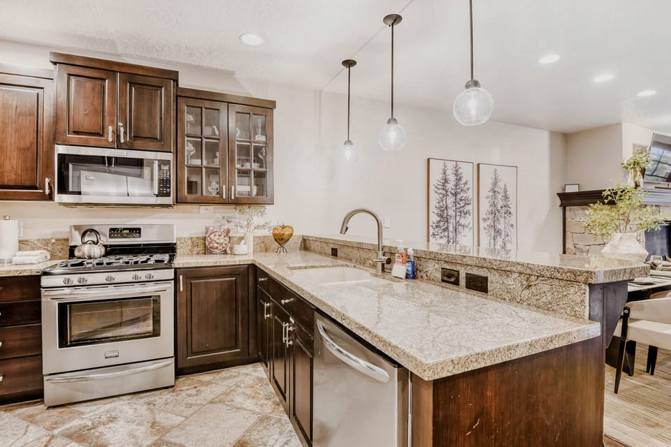 Your gourmet kitchen awaits with granite countertops, stainless steel appliances, and elegant pendant lighting for memorable meal prep.