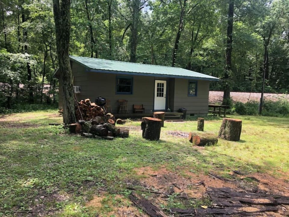 Quaint cabin, offering a humble retreat. With campfires and lake front view. 