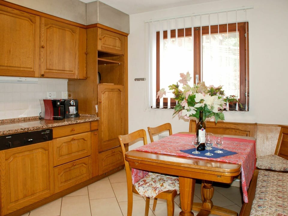 Furniture, Cabinetry, Countertop, Property, Flower, Table, Plant, White, Building, Window