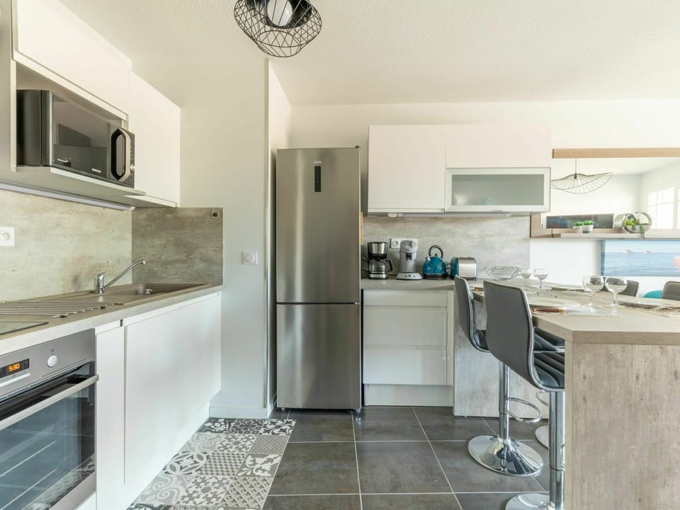 Countertop, Cabinetry, Property, Kitchen Stove, Kitchen Appliance, Kitchen, Home Appliance, Lighting, Interior Design, Building
