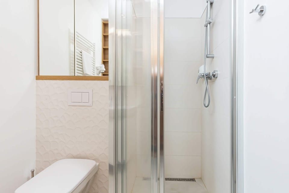 Bright bathroom with washing shower cabin. 