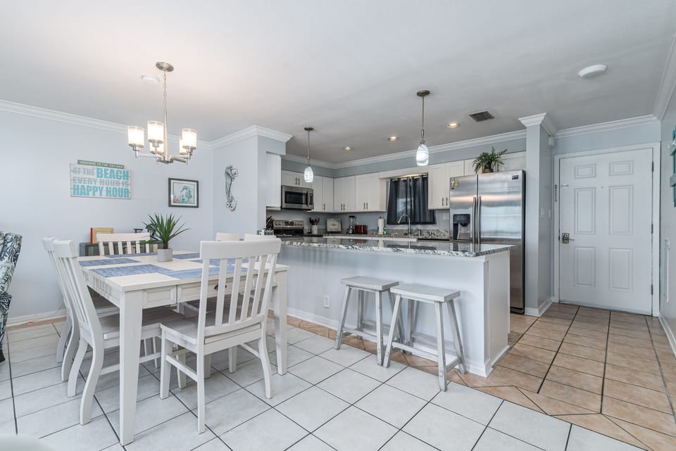Dining area to kitchen bar area