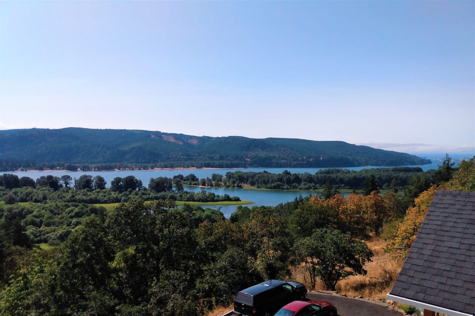 Sweeping views of islands, lagoon, forests, Oregon mountains.