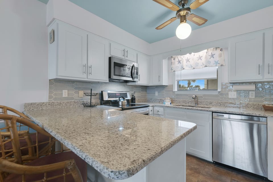 Prepare meals with ease in this bright and functional kitchen, designed for both everyday use and entertaining.