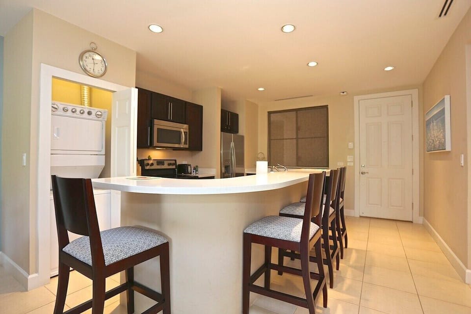 The kitchen has breakfast bar seating for 4 and in-unit laundry.