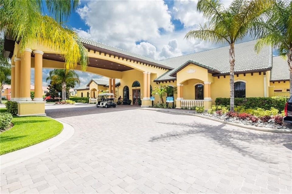 Clubhouse with pool, waterfall, slide, movie theater, gym, games room, Tiki bar