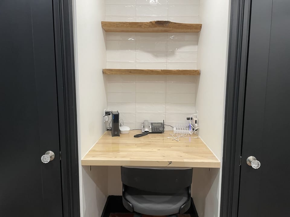 Dedicated built in desk with charging station for your electronics.