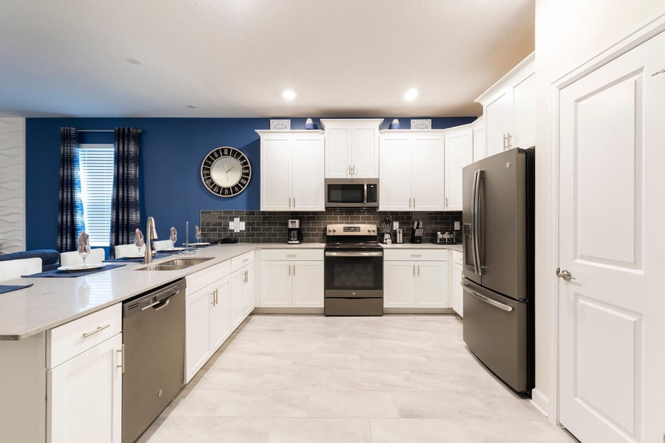 Bright modern kitchen with sleek appliances, island, and style!