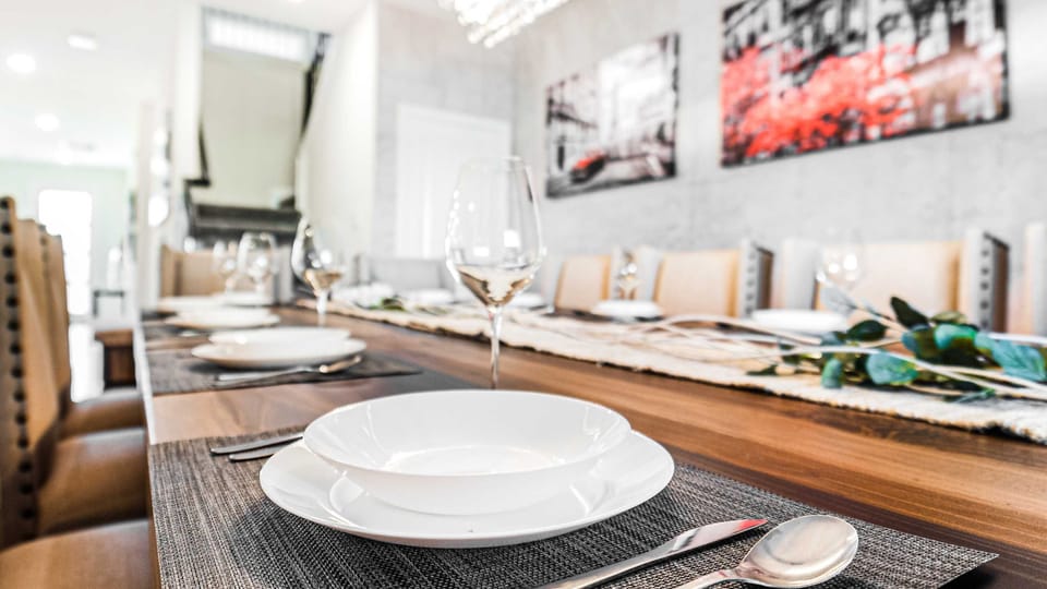 The dining area generously accommodates everyone with a grand 12-seater dining setup.