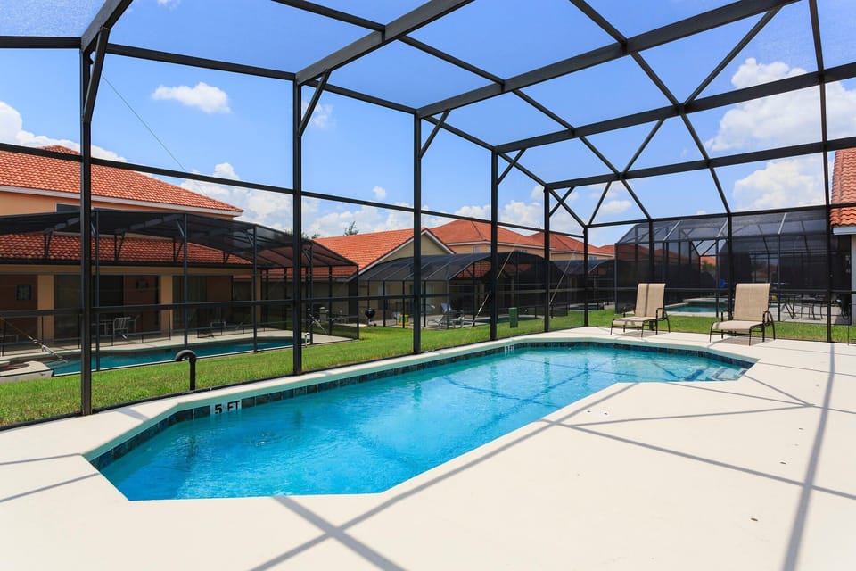 Home Pool: Enjoy a screened oasis, providing a private and serene swimming experience