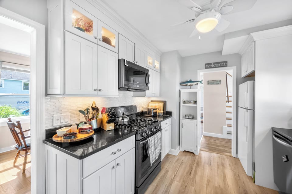 Renovated kitchen looking to stairway