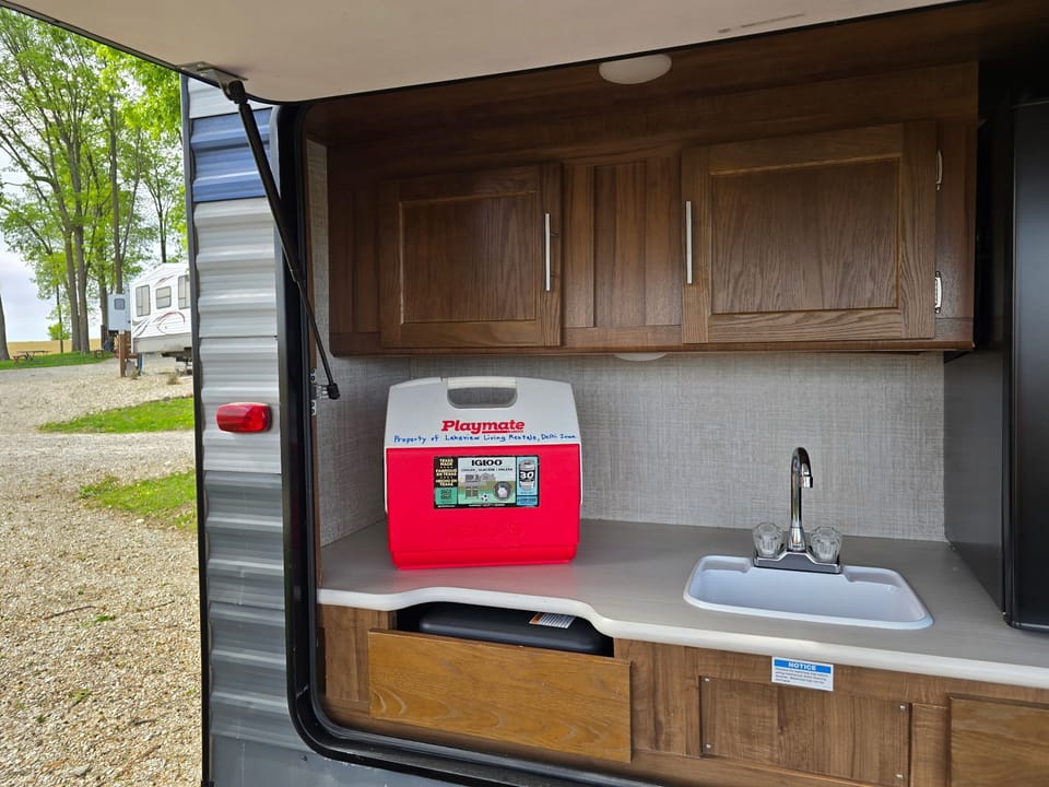 Medium Playmate cooler in the outside kitchenette