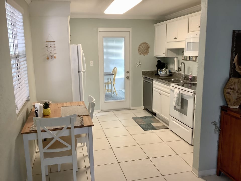 Plenty of dishes, cooking pots and utensils. Drip or Keurig coffee maker. 