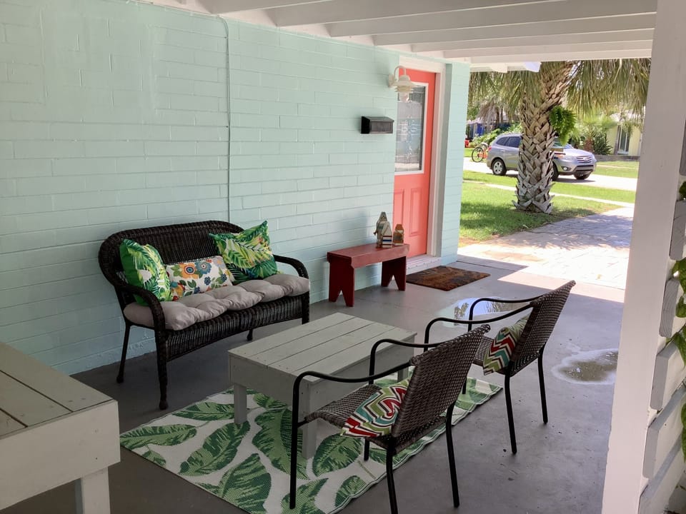 Relax and watch the world go by in the comfortably set up carport. 