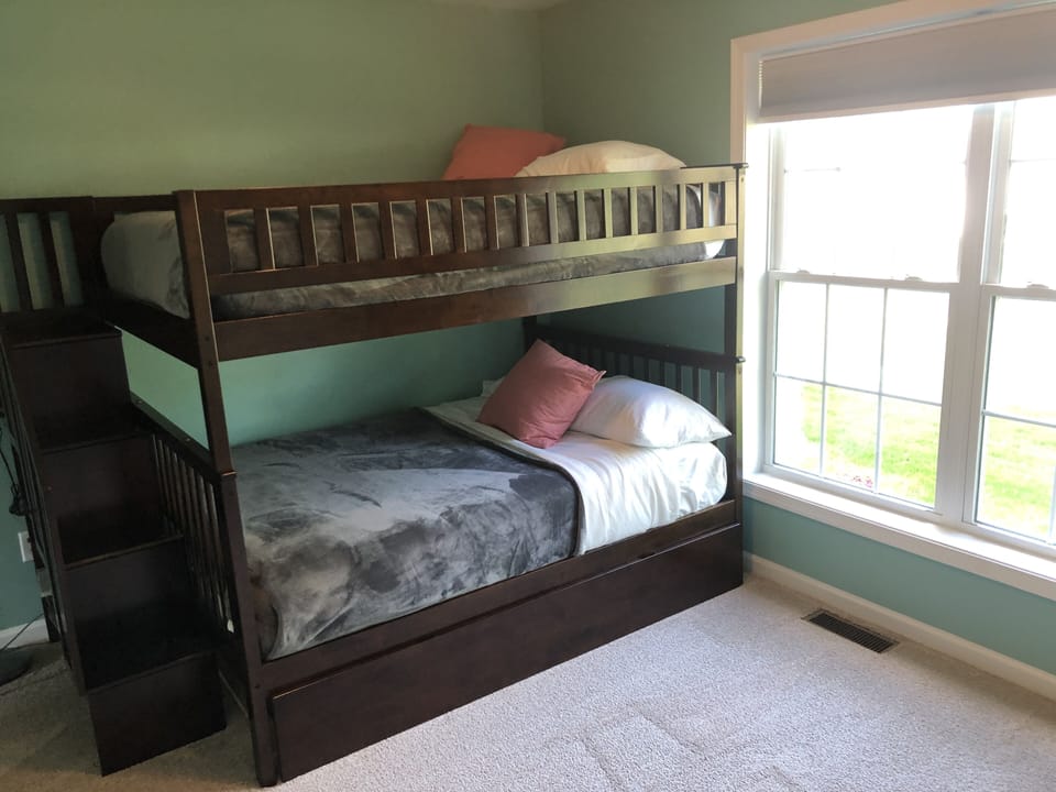 Full over full bunk beds with a single trundle. 
