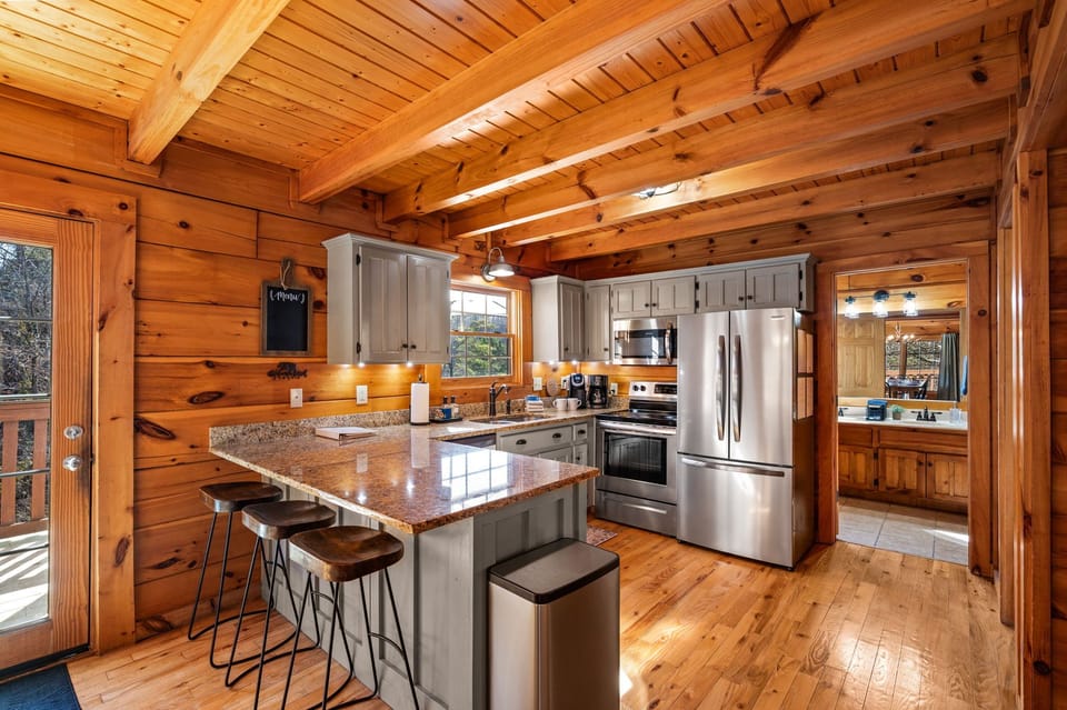 The high end kitchen with granite countertops and stainless appliances await your culinary genius!