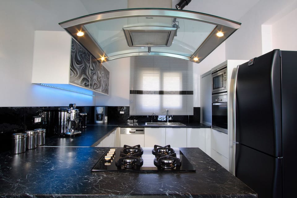 The kitchen is fully equipped with all modern appliances