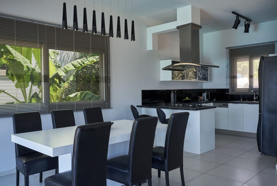 The kitchen is fully equipped with all modern appliances