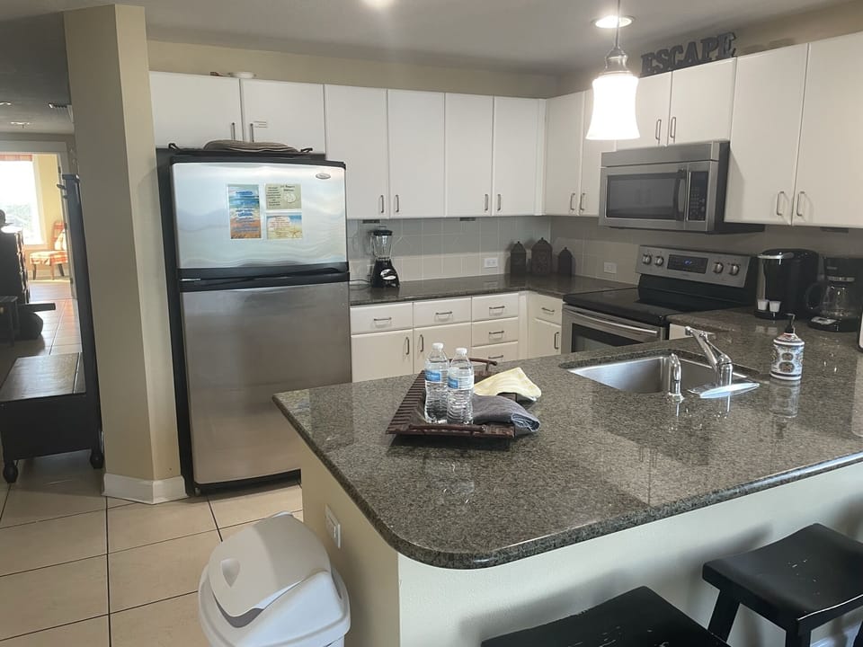 Kitchen w/ full set and dishes, kuerig & regular coffee maker, blender & etc. 