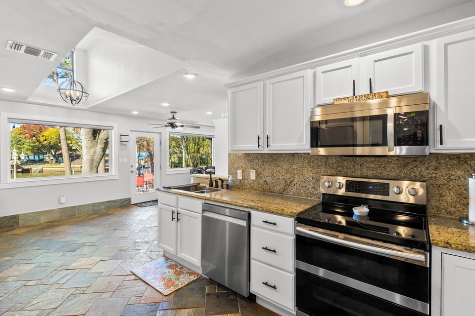 Stainless steel appliances and fully stocked kitchen 