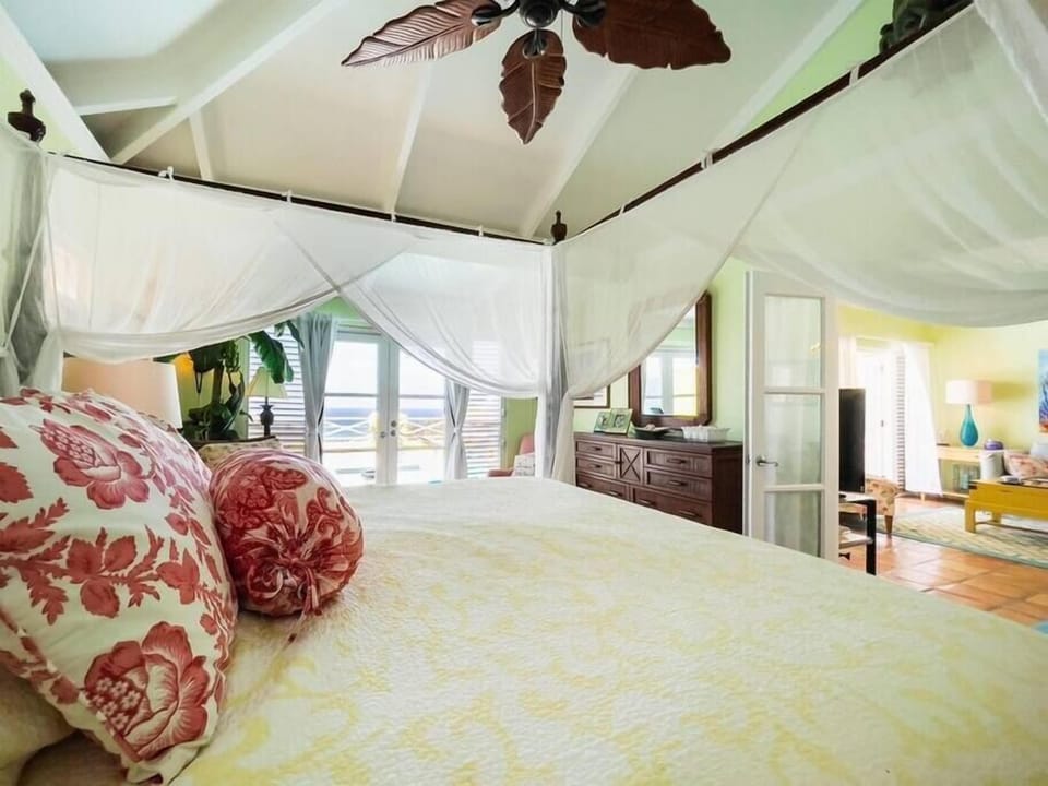 Elegant master suite with pool and ocean view