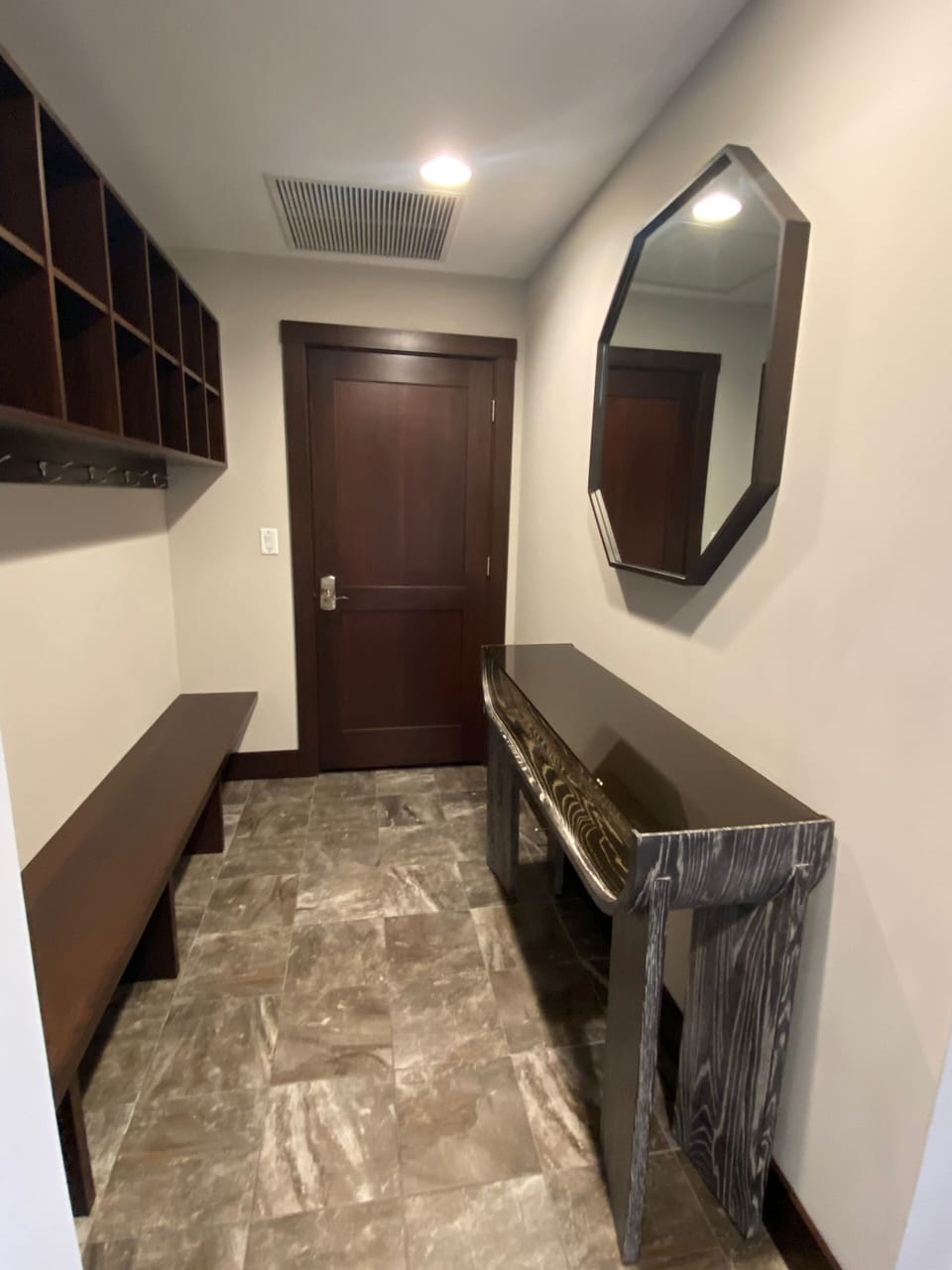 Entrance area with a bench, coat rack and cubbies for all your gear.